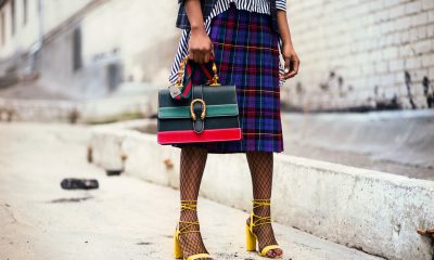 woman holding leather handbag